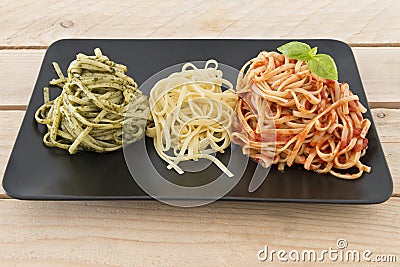 Italian flag made with pasta on wood background