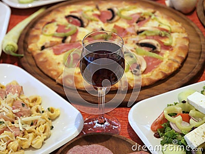 Italian Food Setting With Pizza, Pasta And Win