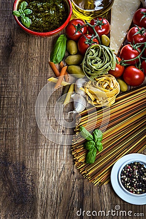 Italian and Mediterranean food ingredients on old wooden background.