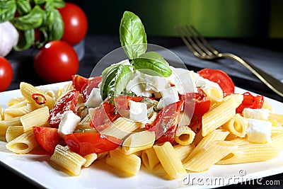 Italian pasta with tomatoes and mozzarella cheese