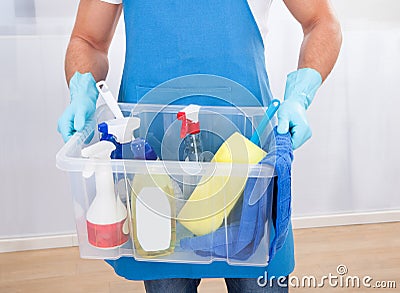 Janitor with a tub of cleaning supplies