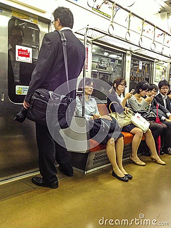 Japanese commuters on train