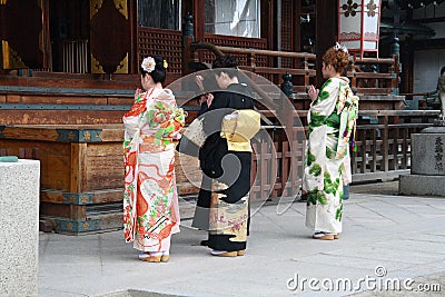 Japanese ladies praying in the temple