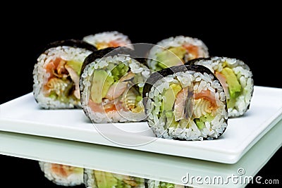 Japanese rolls close-up on black background. horizontal photo.