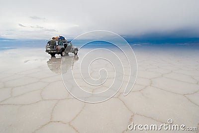 Jeep in the salt lake salar de uyuni, bolivia