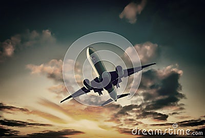 Jet Aeroplane Landing From Bright Sunset Sky