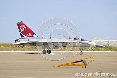 Jet fighter is taxiing on the runway.