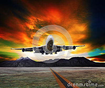 Jet plane flying over runways and beautiful dusky sky with copy