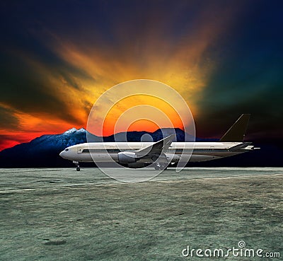 Jet plane flying over runways and beautiful dusky sky with copy