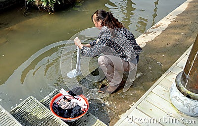 Jie Zi, China: Woman Doing Laundry
