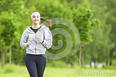 Jogging Sport Concept: Young Running Fitness Woman Training Outd