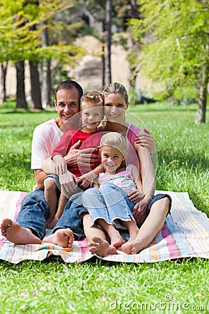 Jolly family at a picnic in a park