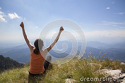 Joyful woman on mountain top