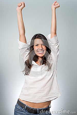 Jubilant young woman cheering her success