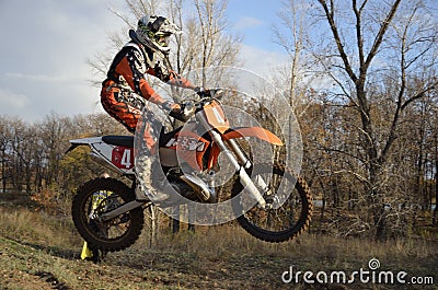 A jump rider on a motorcycle motocross