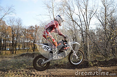 A jump rider on a motorcycle motocross