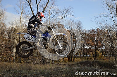 A jump rider on a motorcycle motocross