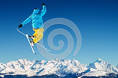 Jumping Skier in high mountains