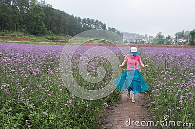 Jumping woman in lavender fields