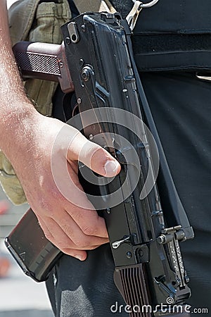 Kalashnikov machine gun in the hands of Ukrainian policeman.
