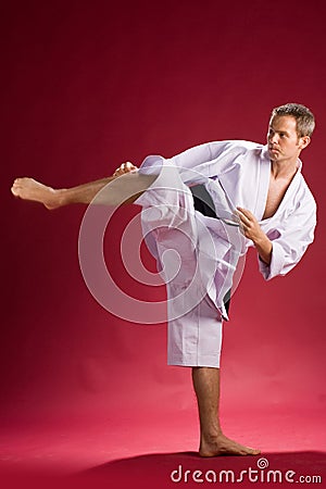 Karate black belt kicking