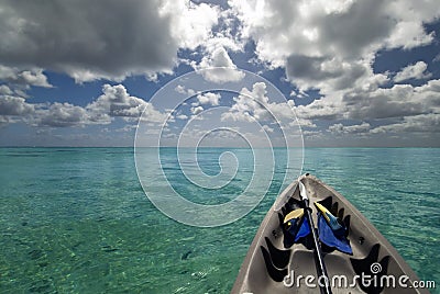 Kayak with snorkeling gear on tropical lagoon.