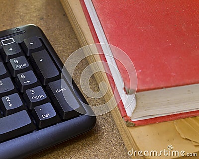 Keyboard and old red book