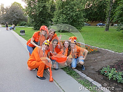 KHARKIV, UKRAINE - JUNE 2012: Dutch football supporers dressed in the national colour Orange. The fans are supporting the national