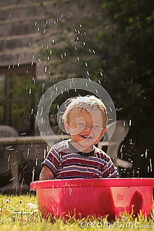 Kid in the grandmothers swimming pool