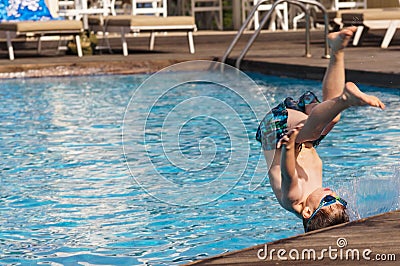 Kid jumping in the pool