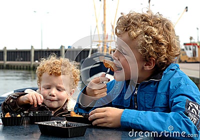 Kids eating fish