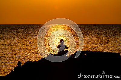 Kids Fishing Silhouette in Sunset