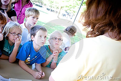 Kids Listening to a Presentation Outside