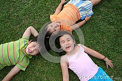 Kids lying on the grass