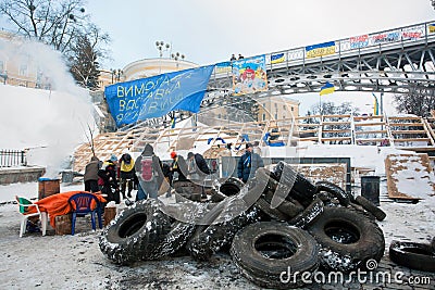 KIEV, UKRAINE: Active people build the barricades with car tires on the main square of capital