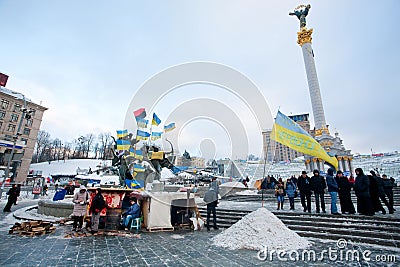 KIEV, UKRAINE: People feel cold but stand with national flags on the main street of capital during anti-government protest