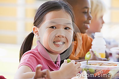 Kindergarten children eating lunch