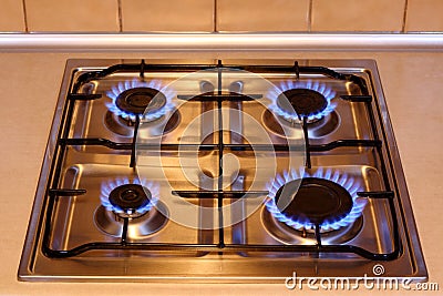 Kitchen gas stove with flames of fire