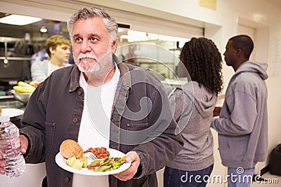 Kitchen Serving Food In Homeless Shelter