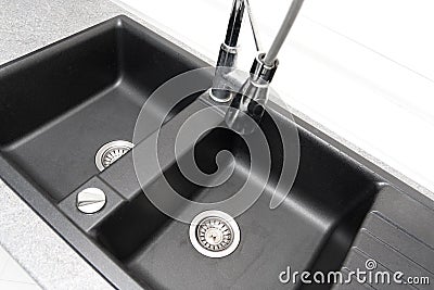 Kitchen sink with the mixer tap