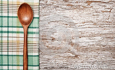 Kitchen utensils on the old wood background