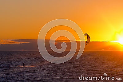 Kite surfer on sunset