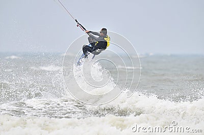 Kite surfing in spray.