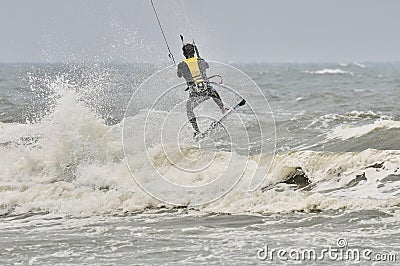 Kite surfing in spray.
