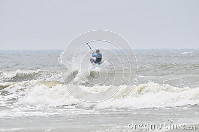 Kite-surfing in spray.