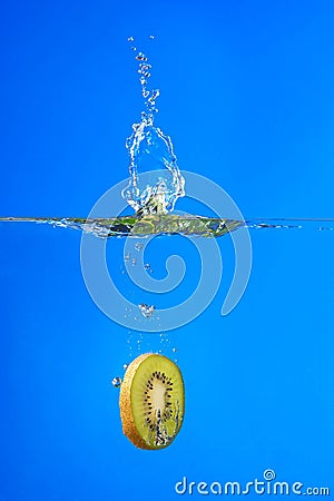 Kiwi, kiwi fruit falling into the water