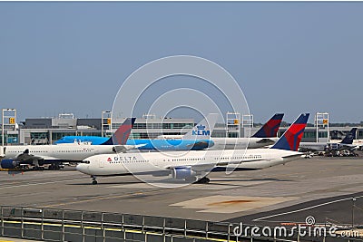 KLM Boeing 747 and Delta Airline planes at the gates at the Terminal 4 at John F Kennedy International Airport in New York