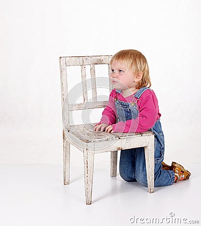 Girl Kneeling On Chair
