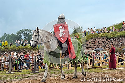 Knight helmet and shield on horseback through the joust