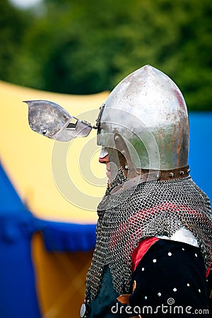 Knight with helmets visor open